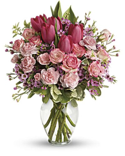 It's beauty-full! Bursting with tantalizing tulips and radiant roses, this delightful pink arrangement brings spring joy to that special someone.
Includes pink roses, tulips, carnations and waxflower, accented with fresh pitta negra and variegated pittosporum.
Delivered in a lovely glass vase.