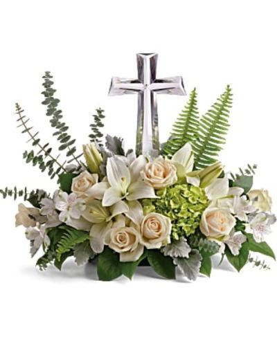 <div id="mark-3" class="m-pdp-tabs-marketing-description">This reverant bouquet of serene white flowers is a beautiful sharing of sympathy, adorned with a majestic crystal cross keepsake.</div>
<div id="desc-3">
<ul>
 	<li>Green hydrangea, crème roses, white asiatic lilies, and white alstroemeria are accented with dusty miller, sword fern, spiral eucalyptus, and lemon leaf.</li>
</ul>
</div>