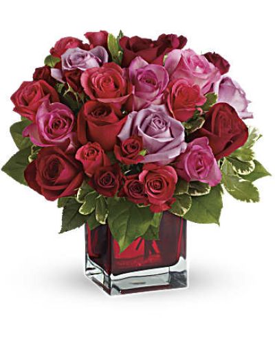 Surprise her with roses in four gorgeous shades of love artistically arranged in a red contemporary cube. Imagine the look on her face when she opens the door and sees this ravishingly romantic bouquet. She'll fall in love with you all over again.